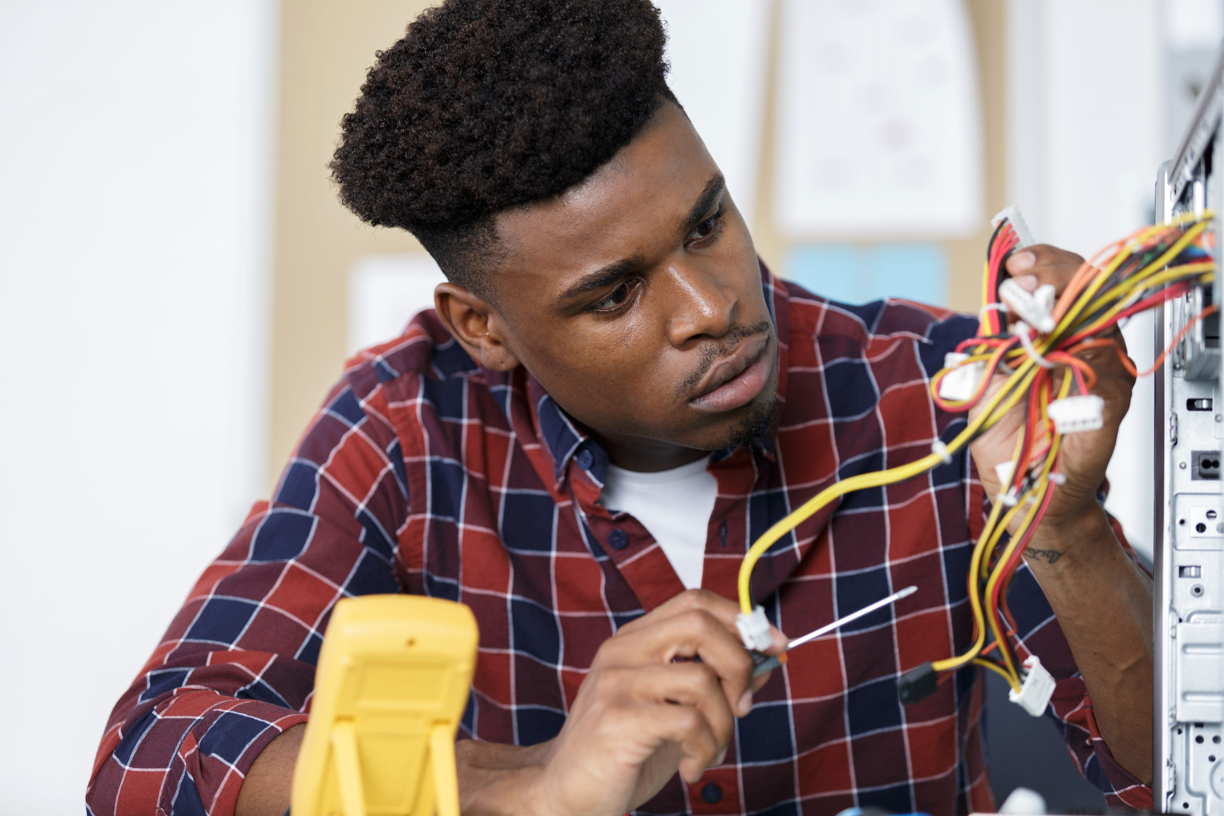 A man is holding cables in his hand